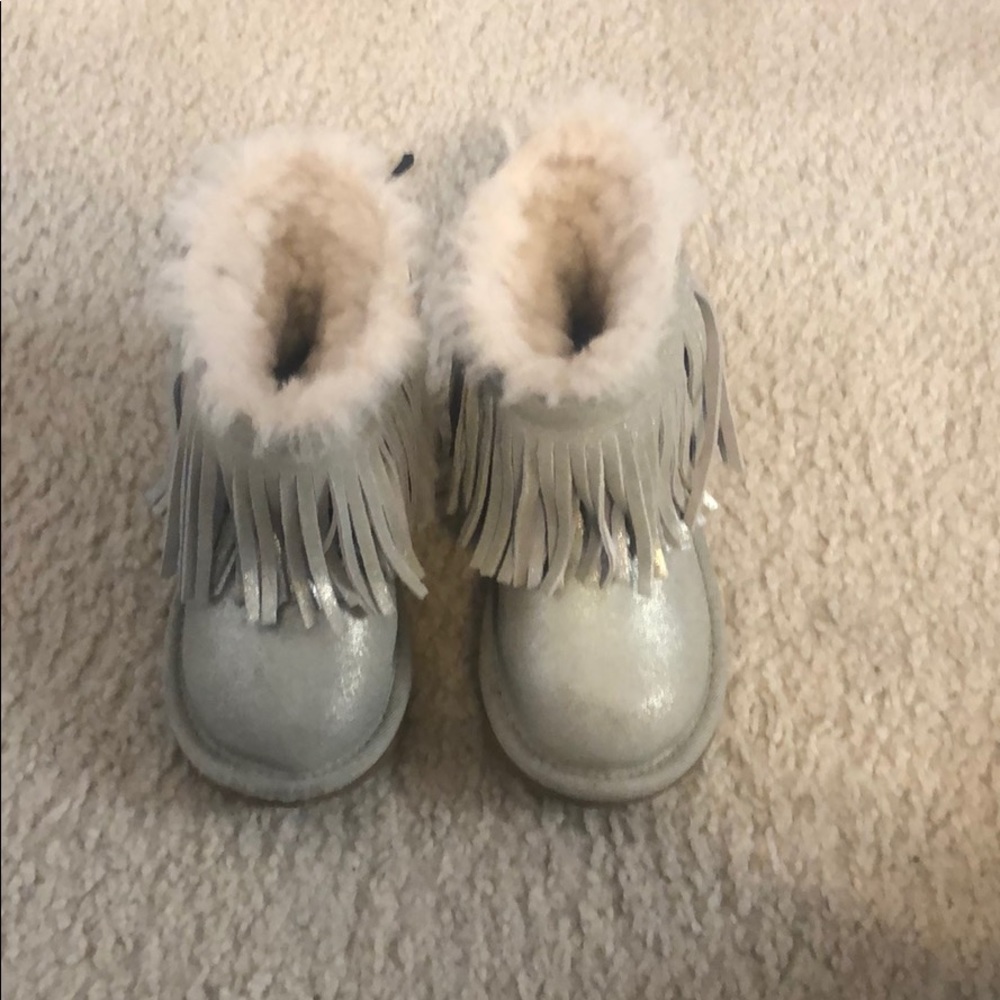 Authentic fringed Ugg boots.